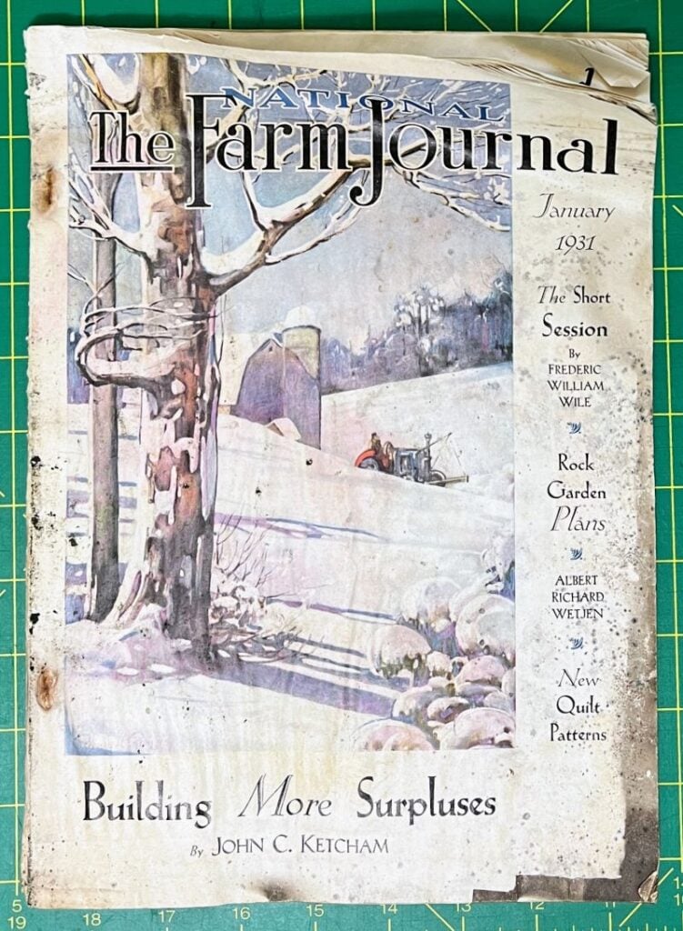 A vintage January 1931 issue of The Farm Journal features a snowy rural scene with a horse-drawn sleigh, bare trees, and rock walls. Headlines include articles on surpluses, garden plants, and quilt patterns.