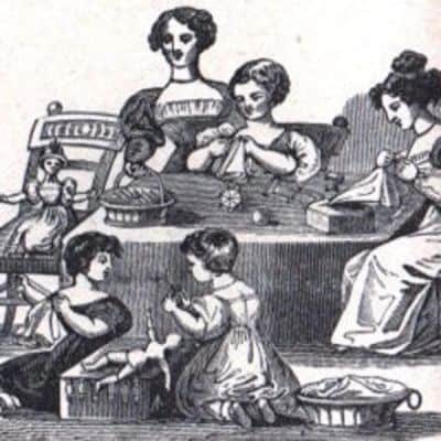 Black-and-white illustration of women and girls gathered around a table, sewing and playing with dolls. Two women sit at the table, with three girls playing on the floor nearby, all engaged in domestic or crafty activities.