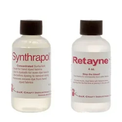 Two clear plastic bottles with white caps are shown. The left bottle is labeled Synthrapol, and the right bottle is labeled Retayne. Both are dye-related fabric care products from G&K Craft Industries.