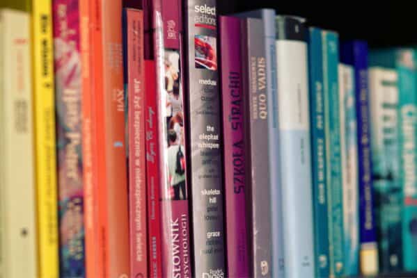 Photo by Karolina Grabowska www.kaboompics.comVibrant array of books on a shelf showcasing diverse titles and colors.