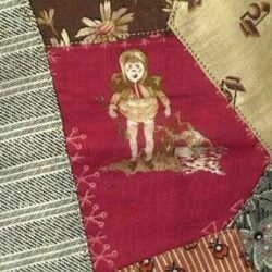 A patchwork quilt section features various fabric patterns. The central red patch shows a vintage-style illustration of a child in old-fashioned clothes and a bonnet, surrounded by other patterned fabric pieces.