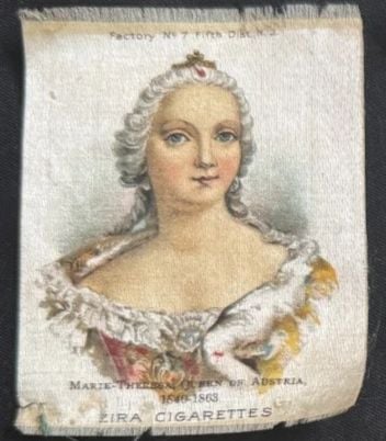 A vintage illustration shows a woman with powdered hair styled high, wearing a jeweled crown and an ornate dress. The text below reads: “Marie-Therese, Queen of Austria, 1717-1780. Zira Cigarettes.”.