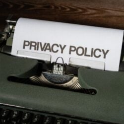 Close-up of a vintage typewriter with a sheet titled Privacy Policy. Photo by Markus Winkler