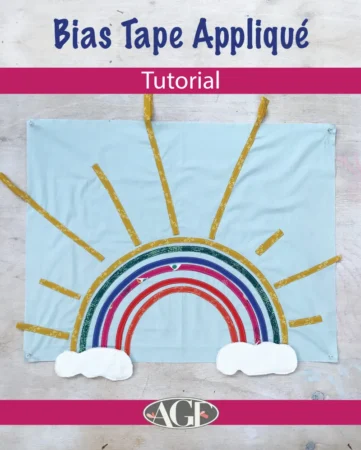 art-gallery-image Fabric rainbow and clouds with yellow bias tape sun rays sewn on a blue cloth, text reads “Bias Tape Appliqué Tutorial,” with the AGF logo at the bottom.
