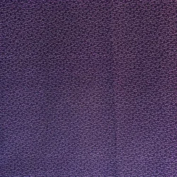 A close-up of Telltale Textiles: Double Purple fabric reveals a small, intricate wavy pattern covering the entire surface. The purple textured fabric appears to have a subtle sheen and a slightly uneven texture.