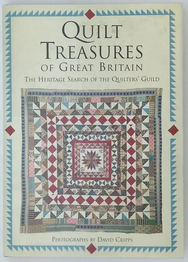 Book cover titled Quilt Treasures of Great Britain with a colorful, geometric quilt design in the center and decorative borders. Text credits photographs by David Cripps.