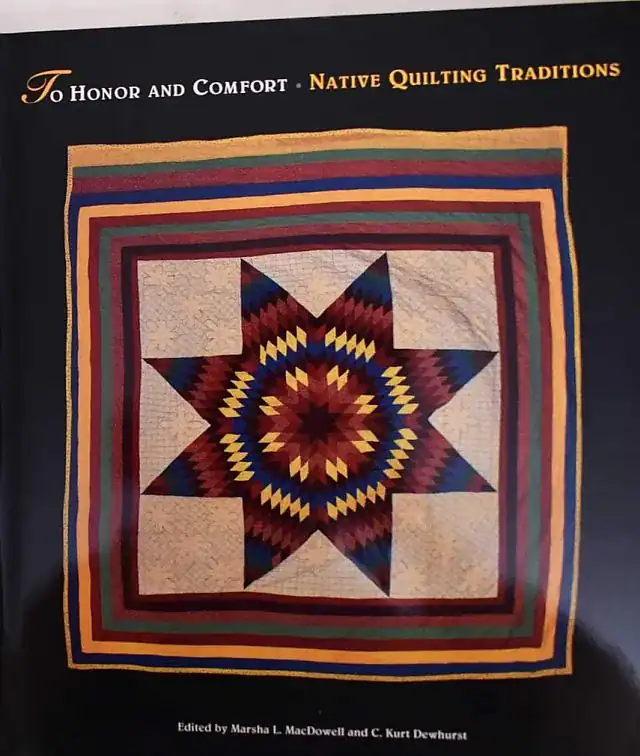 The book cover displays a multicolored Native American star quilt with a striped border. The title reads, To Honor and Comfort: Native Quilting Traditions..