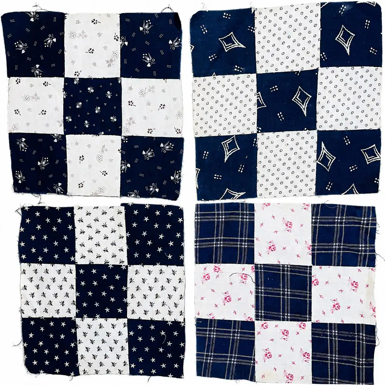 Four patchwork quilt squares, each made of a 4x4 grid of alternating dark blue and white patterned fabric squares with various designs, including stars, diamonds, flowers, and plaid.
