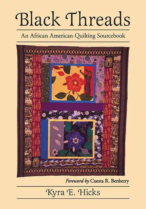 Book cover of Black Threads: An African American Quilting Sourcebook by Kyra E. Hicks, featuring a colorful quilt with floral and human figure designs, bordered by patterned fabric strips.