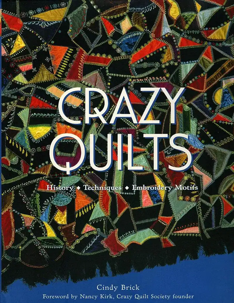 Book cover for Crazy Quilts by Cindy Brick, featuring colorful, irregular quilt patches with embroidery and decorative stitching on a black background. Text highlights history, techniques, and motifs.