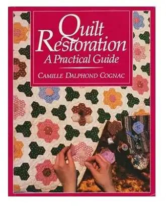 Book cover titled Quilt Restoration: A Practical Guide by Camille Dalphond Cognac, showing a hand quilting a hexagonal-patterned quilt with pink, green, and white fabrics.
