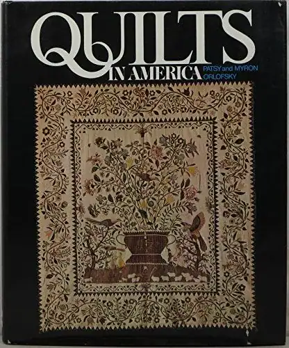 Book cover titled Quilts in America by Patsy and Myron Orlofsky, featuring an ornate quilt with a floral and bird design at the center, bordered by intricate patterns.