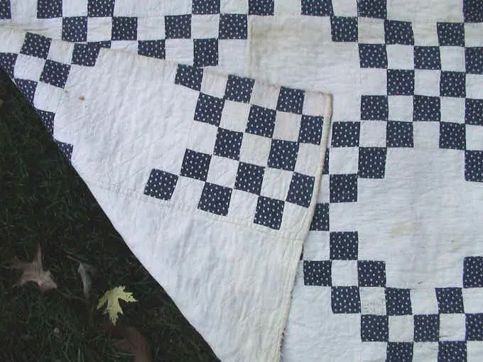 Close-up of the blue polka-dot squares in the Double Irish Chain quilt
